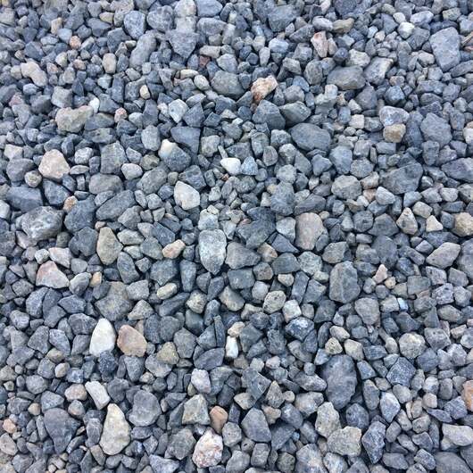 Close-up of small stones and pebbles in various shades of gray and blue ideal for include back filling drains and landscaping tasks