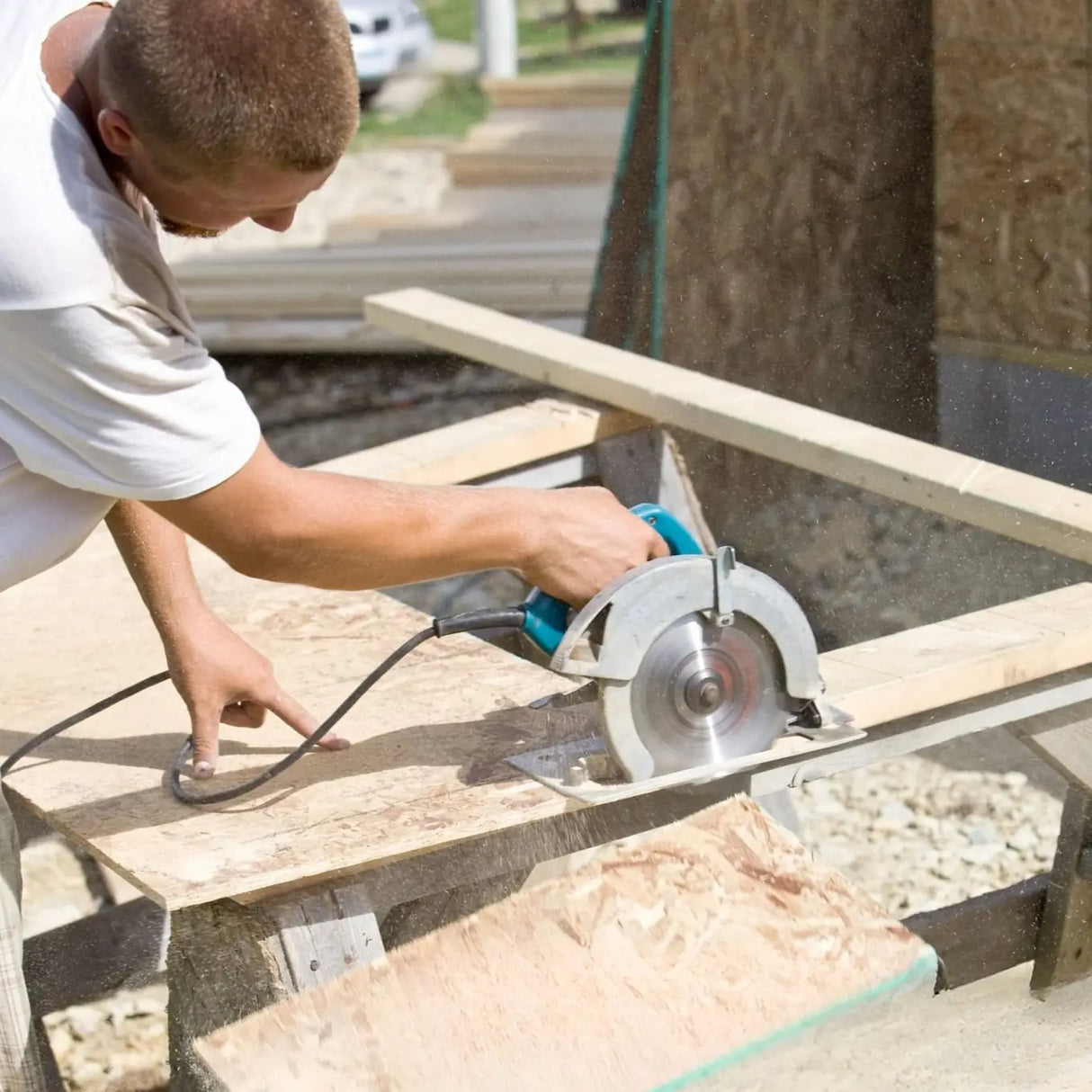Person using a circular saw on OSB board ideal for Used for creating sturdy tables, shelves, and cabinets with an industrial aesthetic.